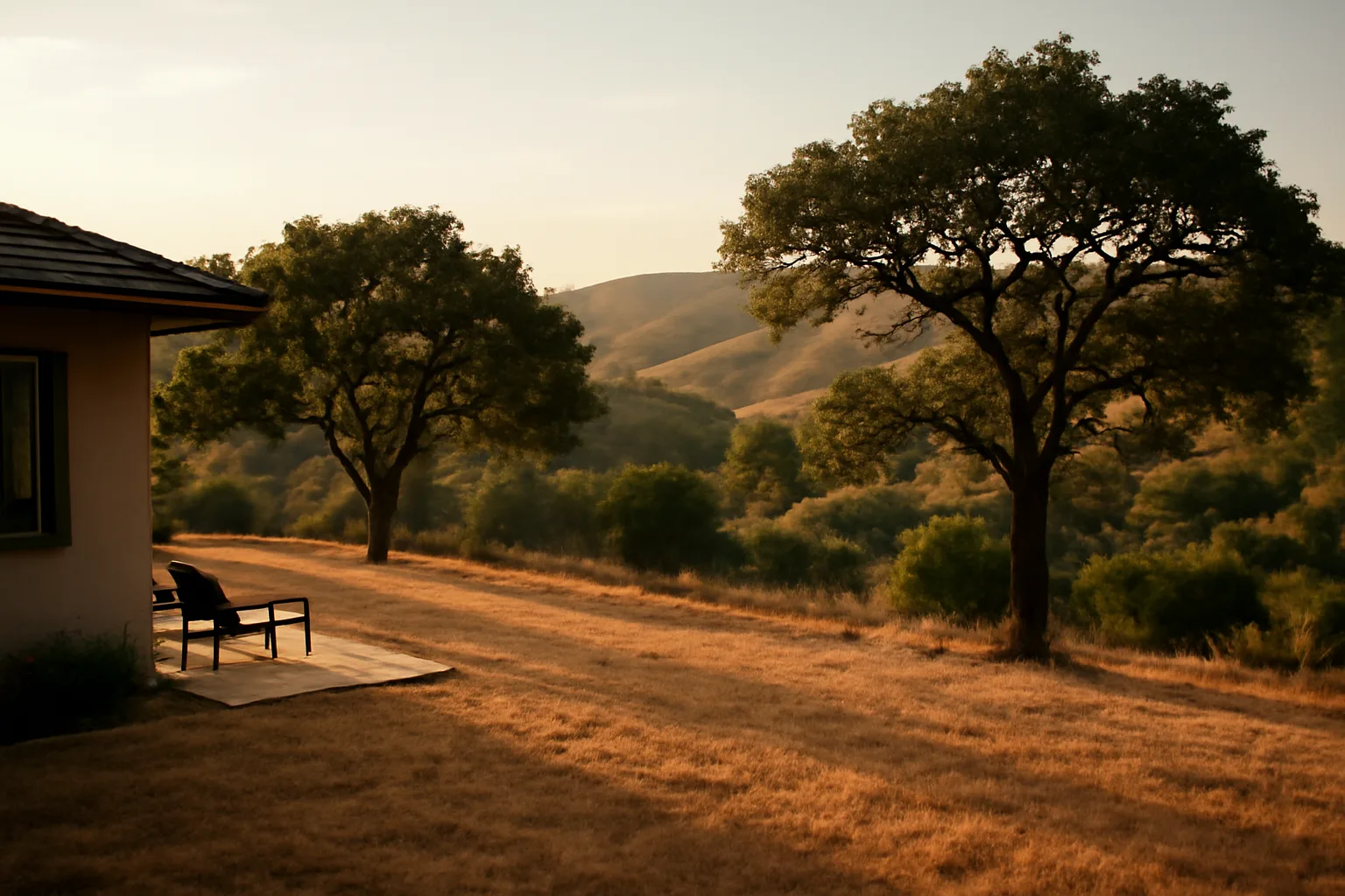 Backyard showing thinned trees and cut grass marking defensible space zone 2 near wildland